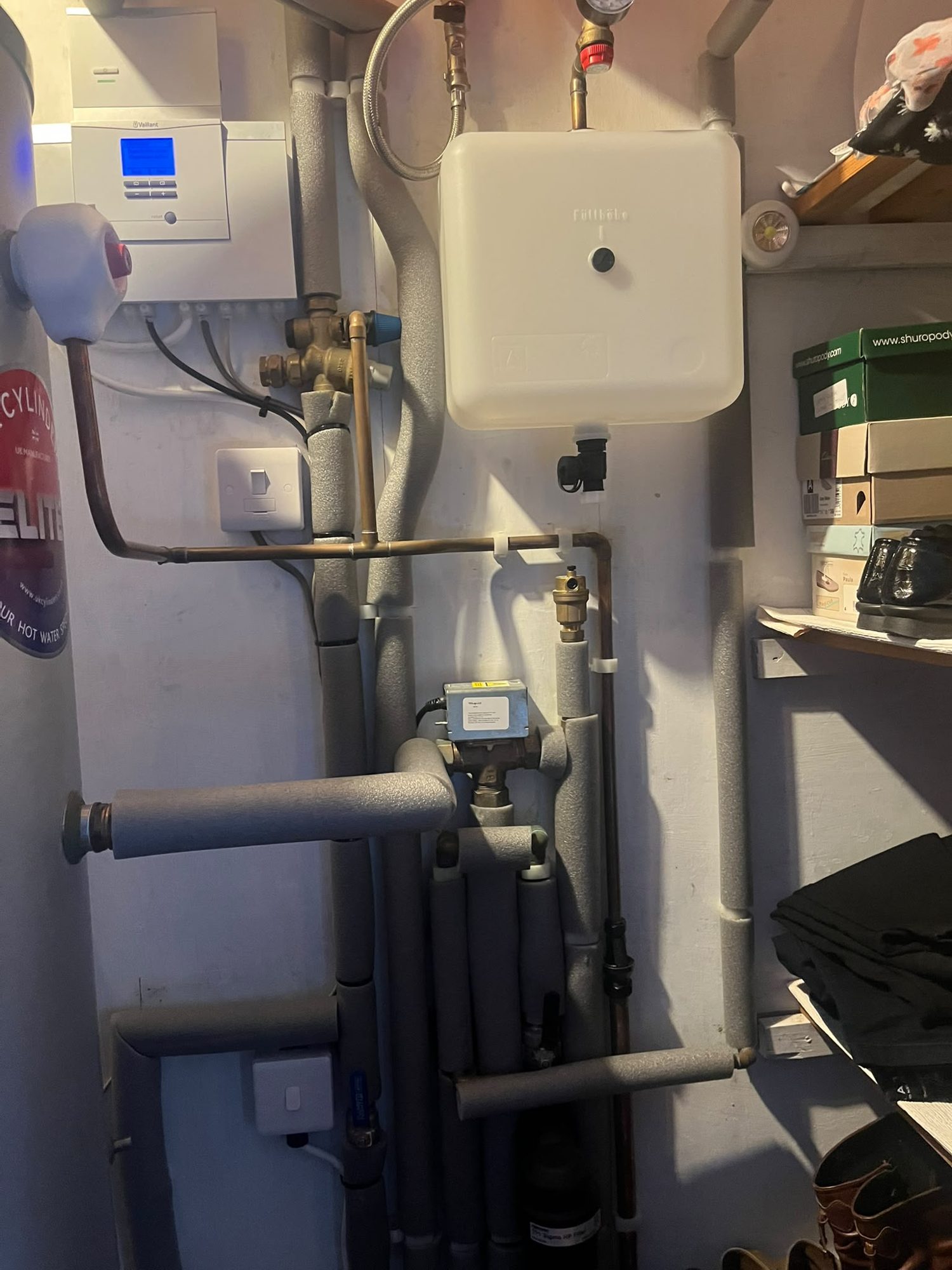 Cylinder cupboard with connected domestic heating pipework