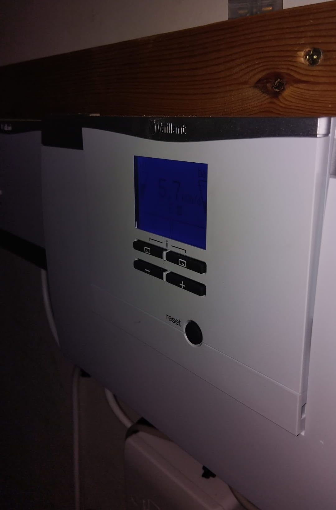 Heating system controller mounted in an equipment cupboard