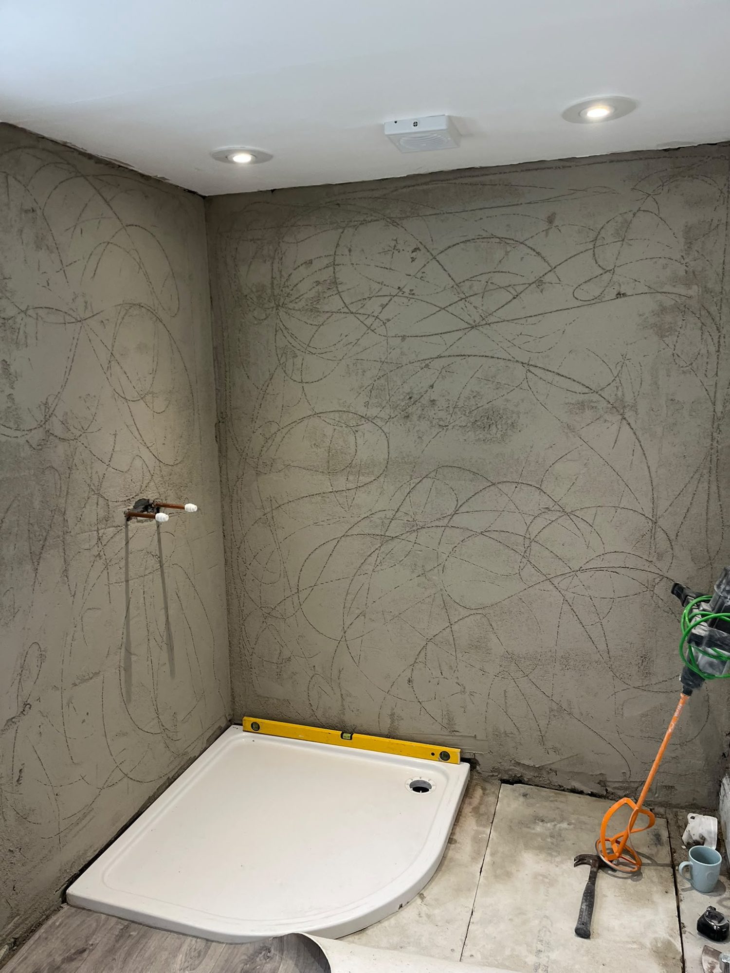 Shower tray with prepared walls and recessed ceiling lights
